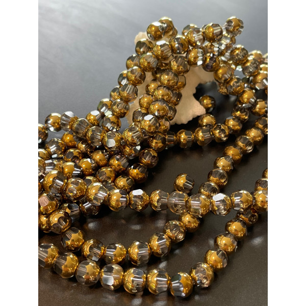 Perles en verre facettés  avec dorure 7 par 8mm