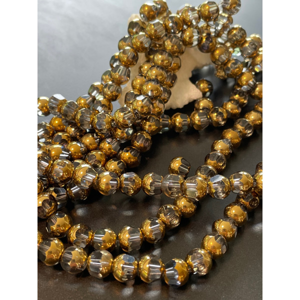 Perles en verre facettés  avec dorure 7 par 8mm