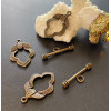 fermoirs T toggle motif feuille