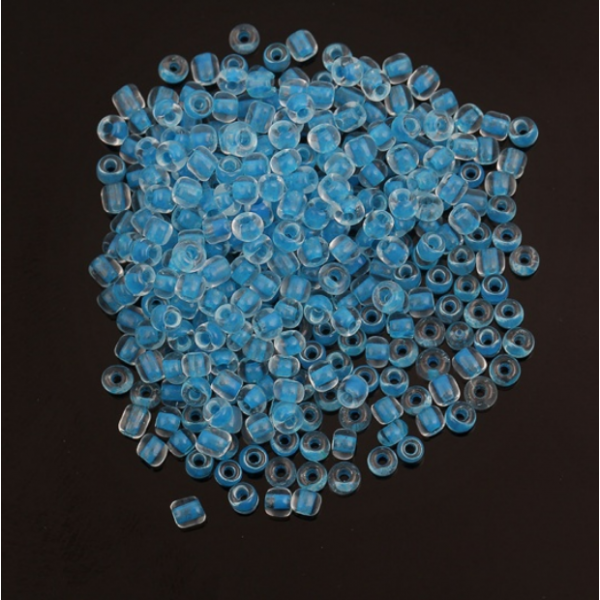 sachet d'environ 1000 Perles de rocaille en verre Bleu 3x2mm 25gr qui s'illumine dans le noir