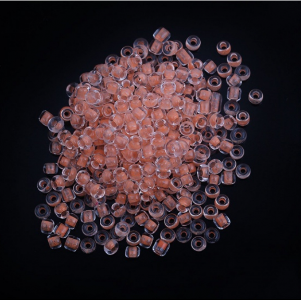 sachet d'environ 1000 Perles de rocaille en verre Rose saumon 3x2mm 25gr qui s'illumine dans le noir