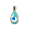 Pendentif Œil de protection Médaillon style émaillés 25 par 11mm métal coloris Doré et Bleu Turquoise