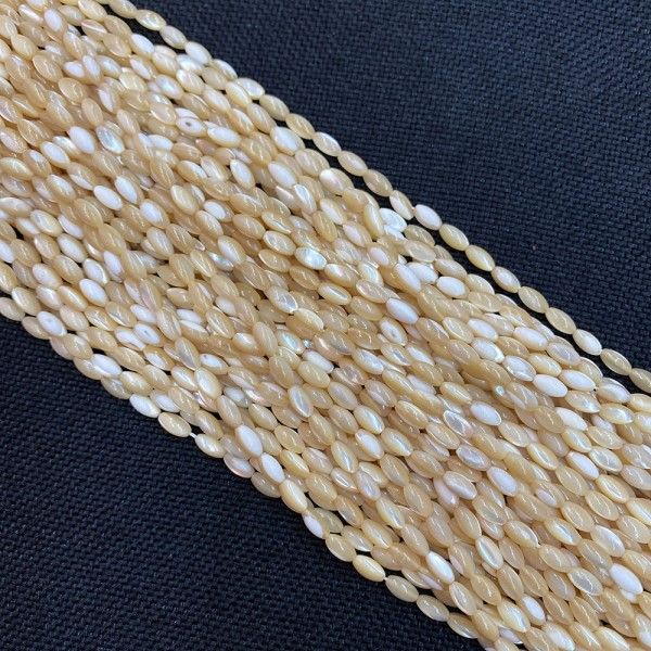 Perles nacre Oblong forme grain de riz  3 par 5 mm coloris Beige Crème