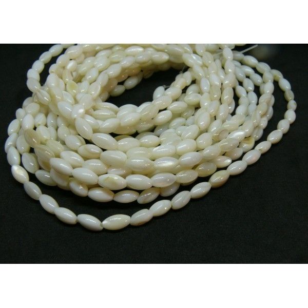 Perles nacre forme Grain de Riz 7 par 4 mm coloris Blanc crème
